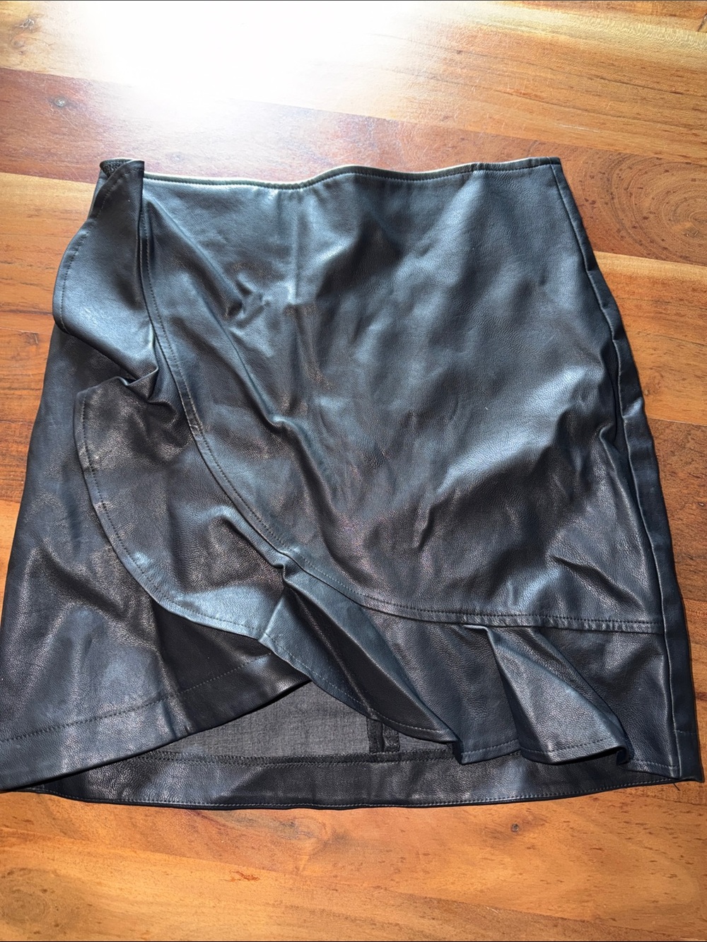Vici Black Faux Leather Mini Skirt with Ruffle Detail